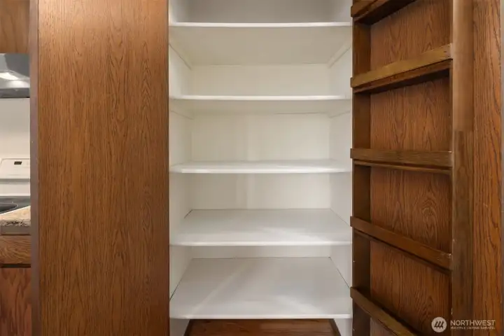 Convenient pantry with double doors & built-in spice rack