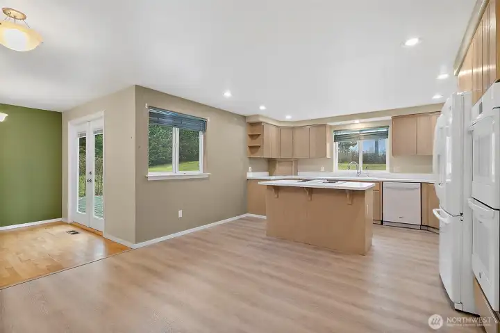 The kitchen is very spacious with abundant cabinetry, pantry closets, storage space, double ovens.