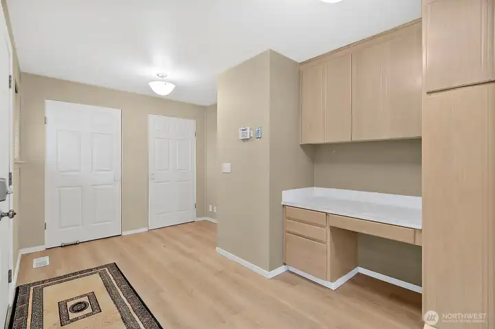 These two closets off the kitchen area are wonderful for pantry storage, small appliance storage and the door that leads you to the backyard.