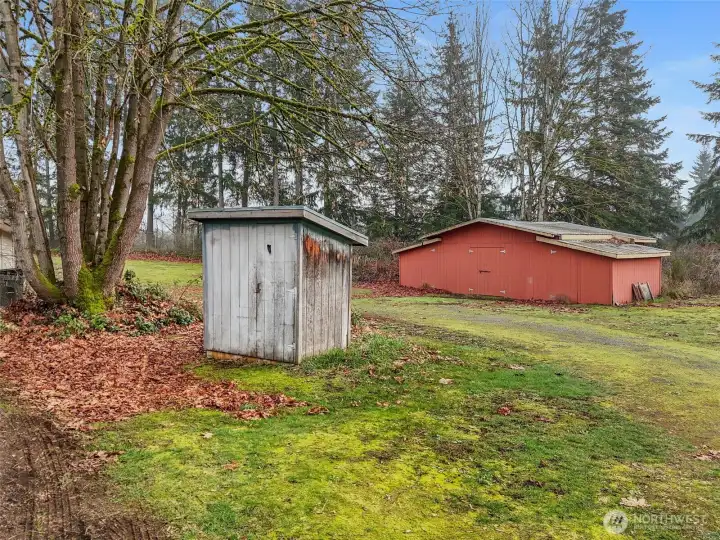 A view of the barn and the pump house for the well.