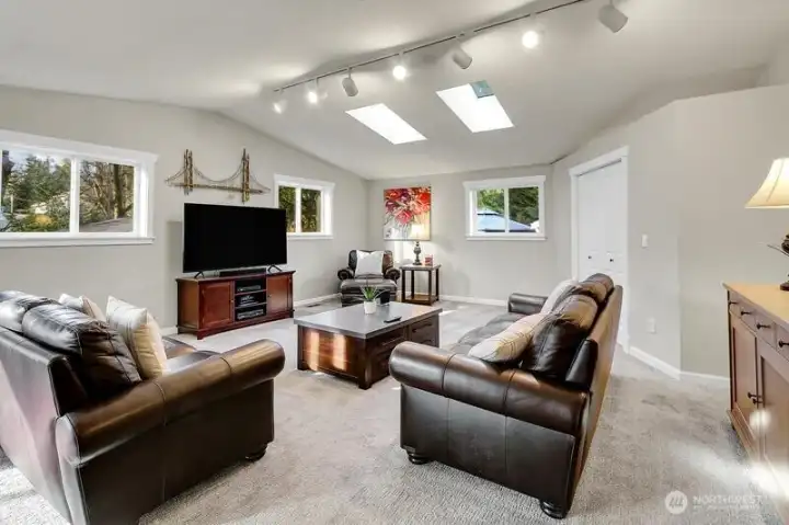 The huge Family room with skylights, vaulted ceiling and office nook is a fantastic place to enjoy your time.