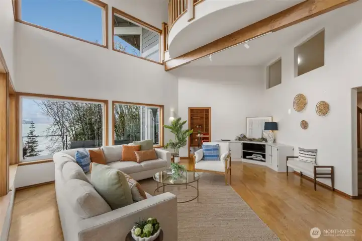 Dedicated office through doorway straight on and curved viewing mezzanine above.