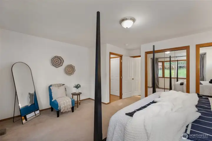 Another view of main floor primary looking onto attached bath.