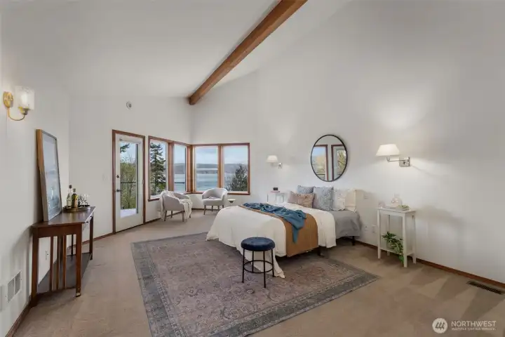 HUGE upper level primary suite with views, access to private balcony and several large closets.