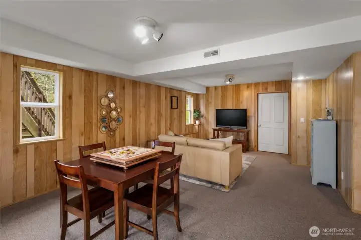 More of the lower level...HUGE storage room behind that door! This area plumbed for kitchenette! More pictures in supplements!