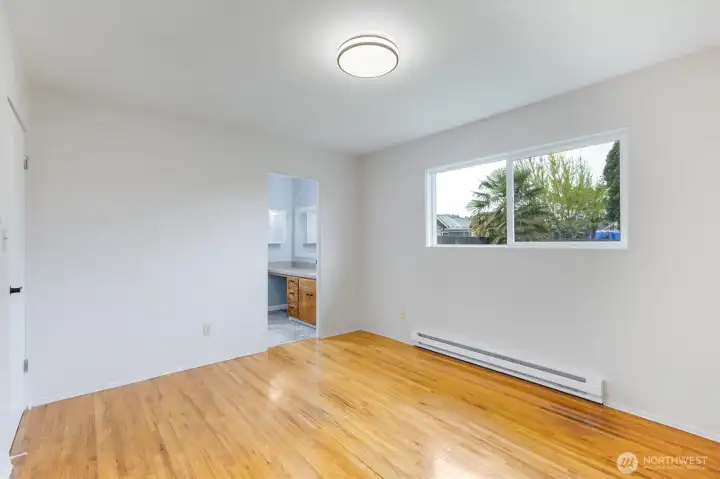 Primary w/ new baseboard heater and more vinyl windows Primary w/ new baseboard heater and more vinyl windows