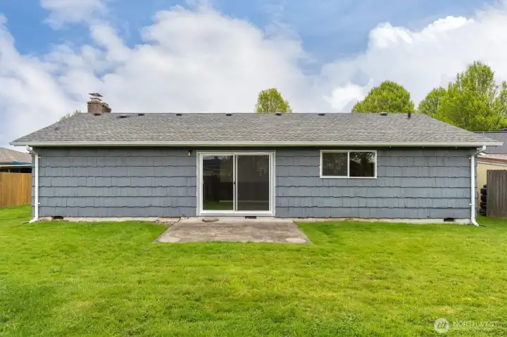 Back of home with small Patio