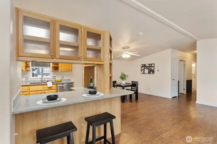 Lovely built in cabinets with eat in kitchen bar