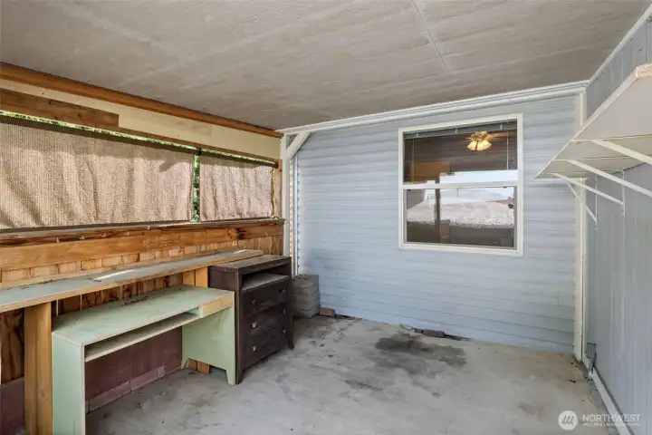 This is fun little area behind the storage space - can be used as a potting shed, or even a great place to have your BBQ!