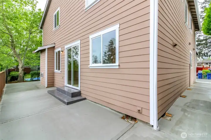 Wide Concrete Patio wrap around the house.