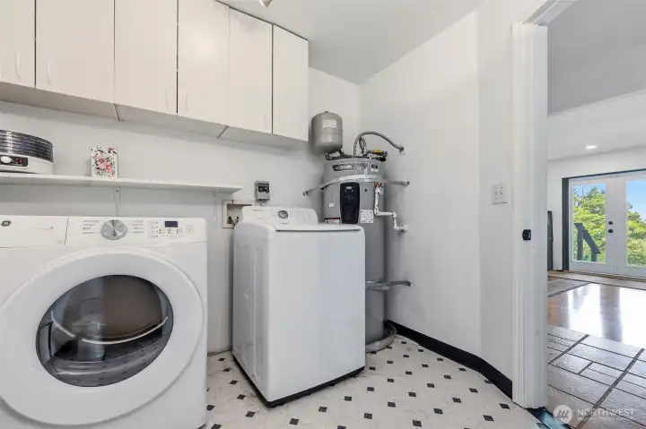 Spacious utility room/half bath on the main floor.
