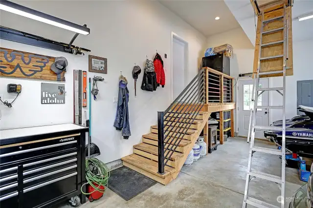 Garage entry to laundry area and then into the home. Stairs are to a huge finished bonus/flex space!