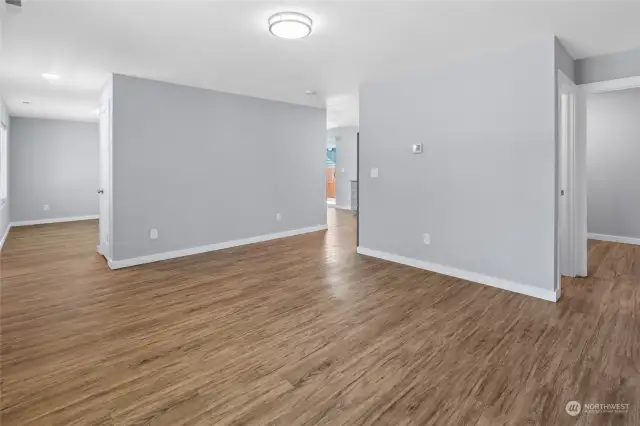 The second living area that provides access to the kitchen as well.