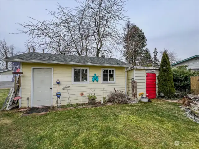 View of one of the garages and storage shed.