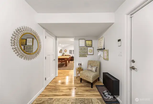 The mud room with the garage on the right and laundry (out of this photo) plus coat closet on the left.