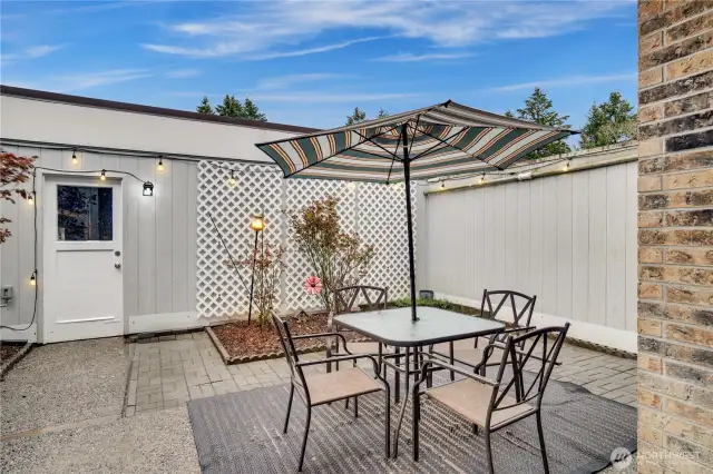 Your private outdoor patio with secure door to the large two car garage.  Great space for catching sun, growing fruits and vegetables, or unwinding at the end of the day.