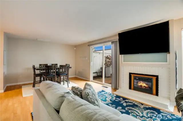 Enter to a large living room that can be used for cozy nights, work and deskspace, or extended dining room - you choose!