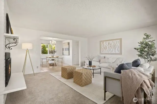 The cozy living room awaits you upon entering. Freshly painted interior throughout the home.
