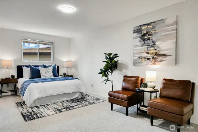 large primary suite has room for sitting area and features dual closets & 3/4 ensuite bath