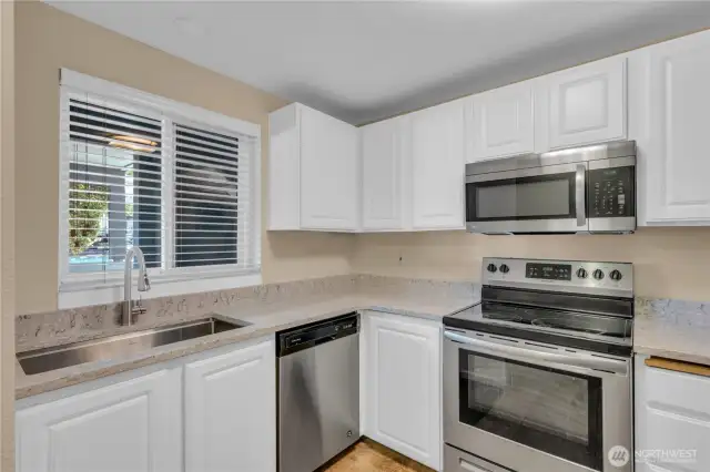 A sunny window in the kitchen lets in the natural light.