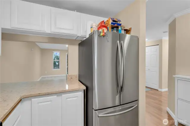 A pass-thru in the kitchen opens to the dining area.