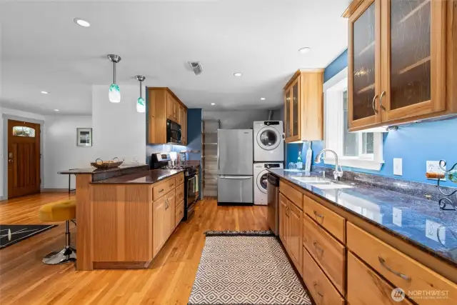 Efficient galley-style kitchen with glass-front cabinetry—perfect for showcasing dishware and keeping everything within easy reach.