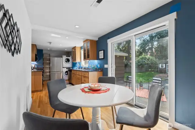 Enjoy meals with a view—sliders off the dining area lead to a peaceful, private backyard setting.