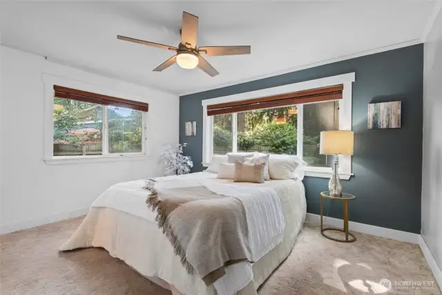 Welcome to the primary bedroom—a comfortable, light-filled retreat with thoughtful touches throughout.