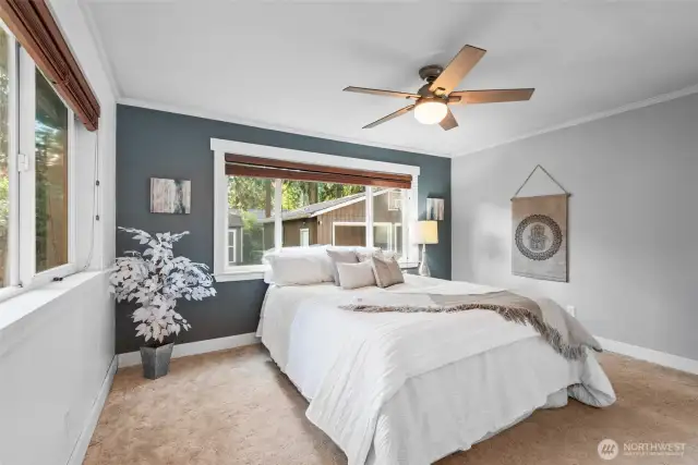 Enjoy the natural light from two oversized windows, complete with wooden blinds for a warm, polished look.