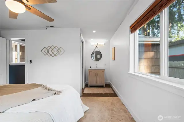 The primary bedroom features its own private bath for added comfort and convenience.