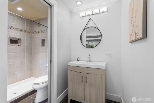 Step into the private primary bath, designed with comfort and function in mind.