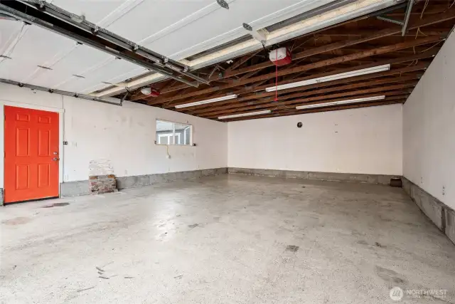 Easy access to the double garage with an additional man door—perfect for quick entry without opening the main doors.