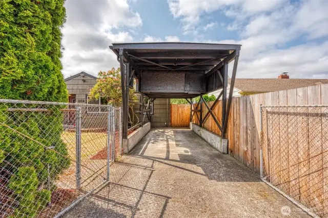 RV carport with storage give options! has storage above and electrical, has a secondary gate.