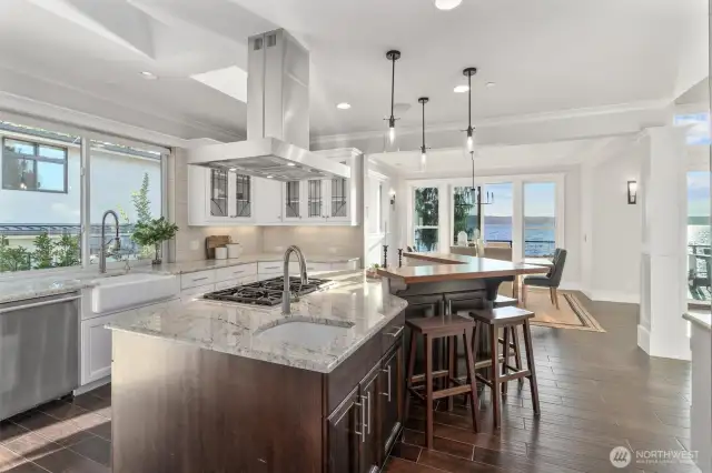 The chef’s kitchen boasts a spacious island perfect for meal prep and casual dining.