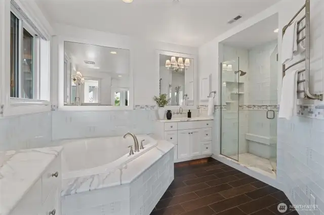 Indulge in a spa-inspired marble bathroom paired with an expansive walk-in closet for ultimate luxury and convenience.