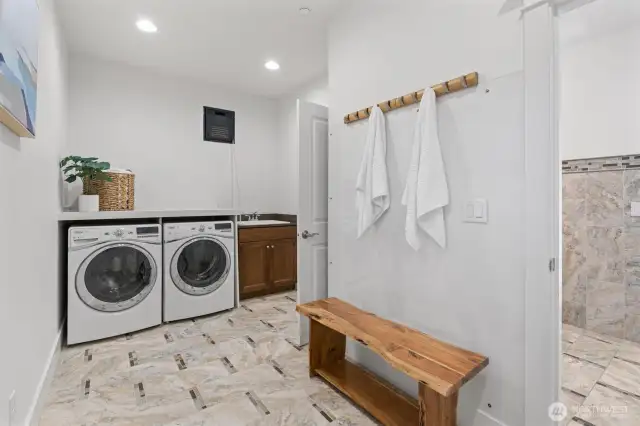 Designed for lakeside living, the oversized laundry room includes room to store and dry wetsuits and water essentials.