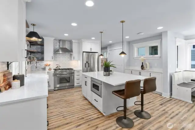 Over 1,100 square feet of comfort and style featuring high-end stainless steel appliances, quartz counters, a gas fireplace, and a built-in desk.