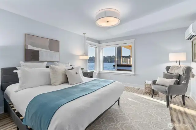 The spacious bedroom is filled with natural light and thoughtfully separated for privacy and comfort.