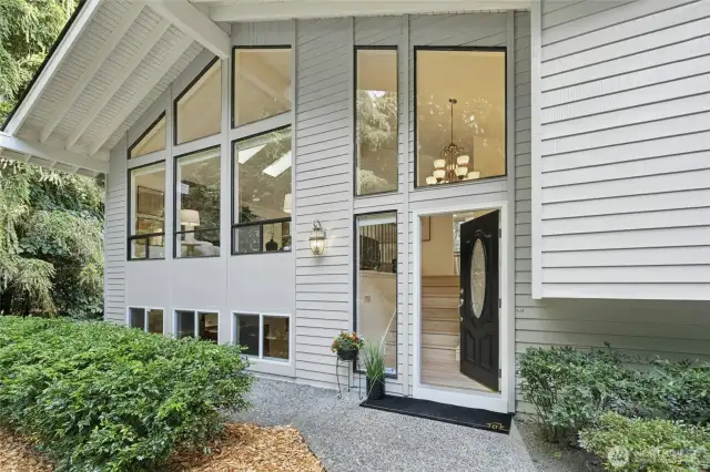 Walls of windows make this home so light and bright.