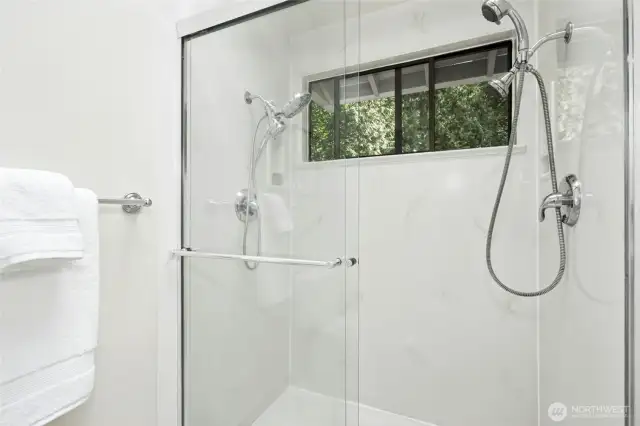 Freshly painted bath with new lighting and fan.