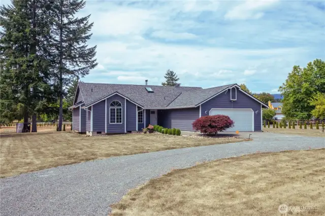 Front of house, has a circular driveway