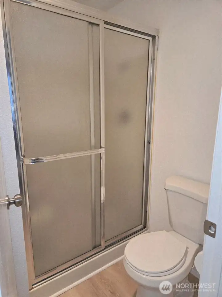 Privacy door separates the shower room from the vanity.