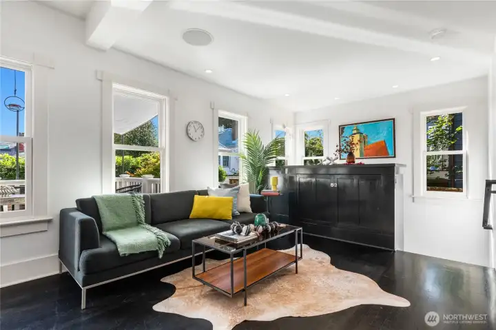 Adjacent family room with custom cabinet with automatic TV riser