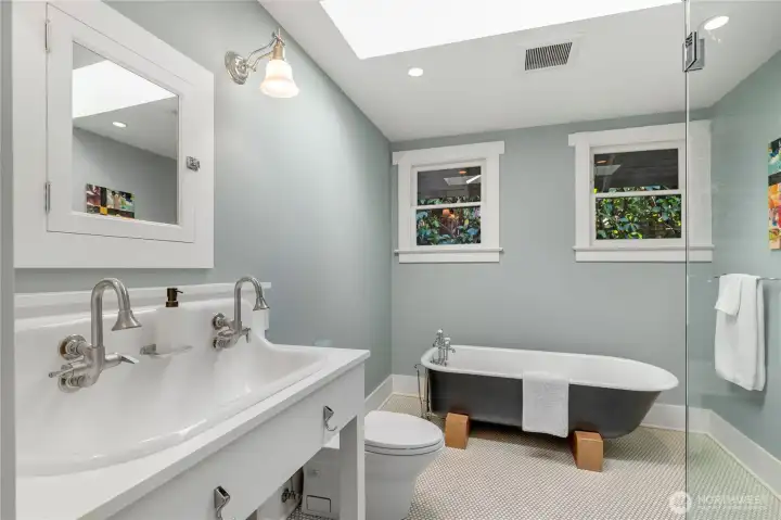 Meticulously updated full bath, with charming original tub