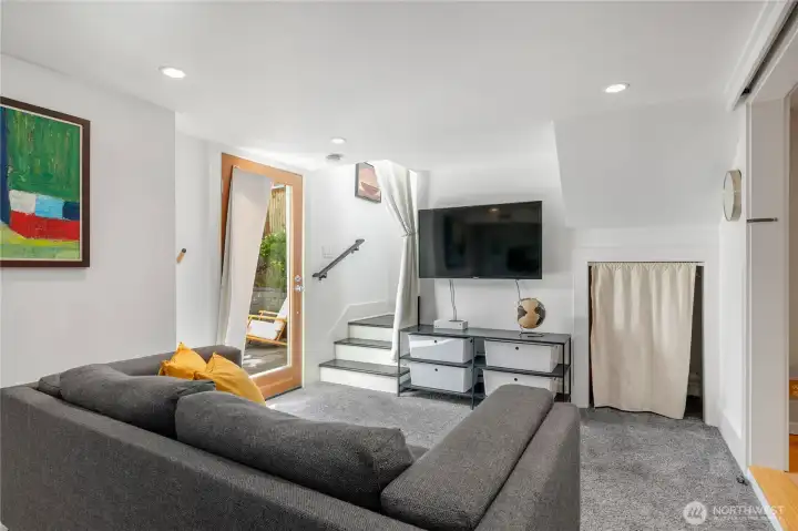 Cozy movie watching or gaming area with walk out to lower outdoor patio