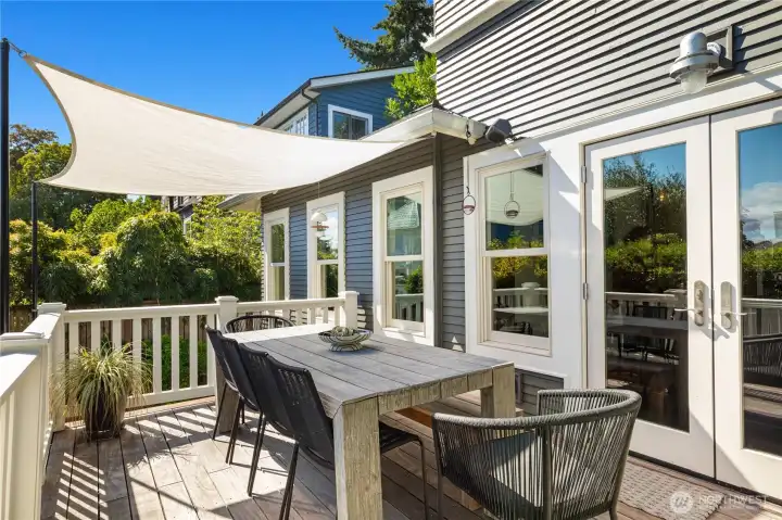 Upper back deck with custom awning and lake and mountain views