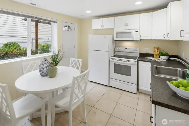 Beautiful kitchen in the basement apartment. Exterior access door to right of window.