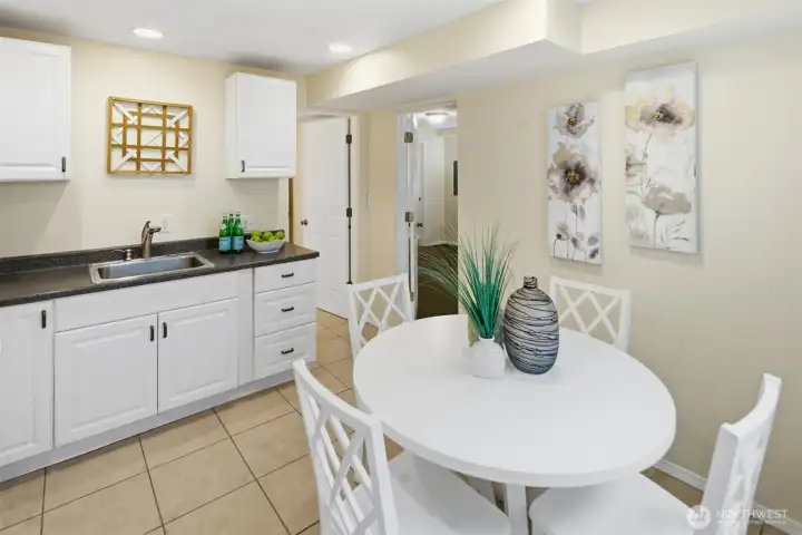 Apartment eat in kitchen with doors to the full bathroom and bedroom.