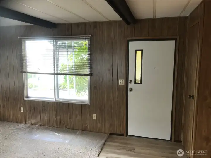 Front door and coat closet to the right