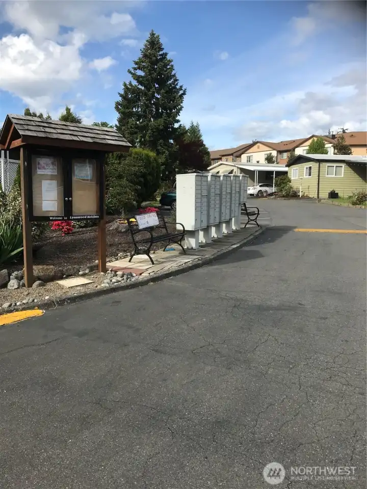 View of mailboxes and bulletin board looking north